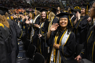An App State Class of 2025 graduate waves to the crowd during the university’s 1 p.m. Spring 2025 Commencement ceremony for the College of Arts and Sciences, held May 9. 